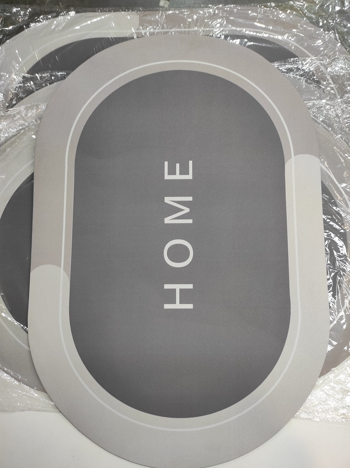 Alfombra de ducha súper absorbente ovalada gris